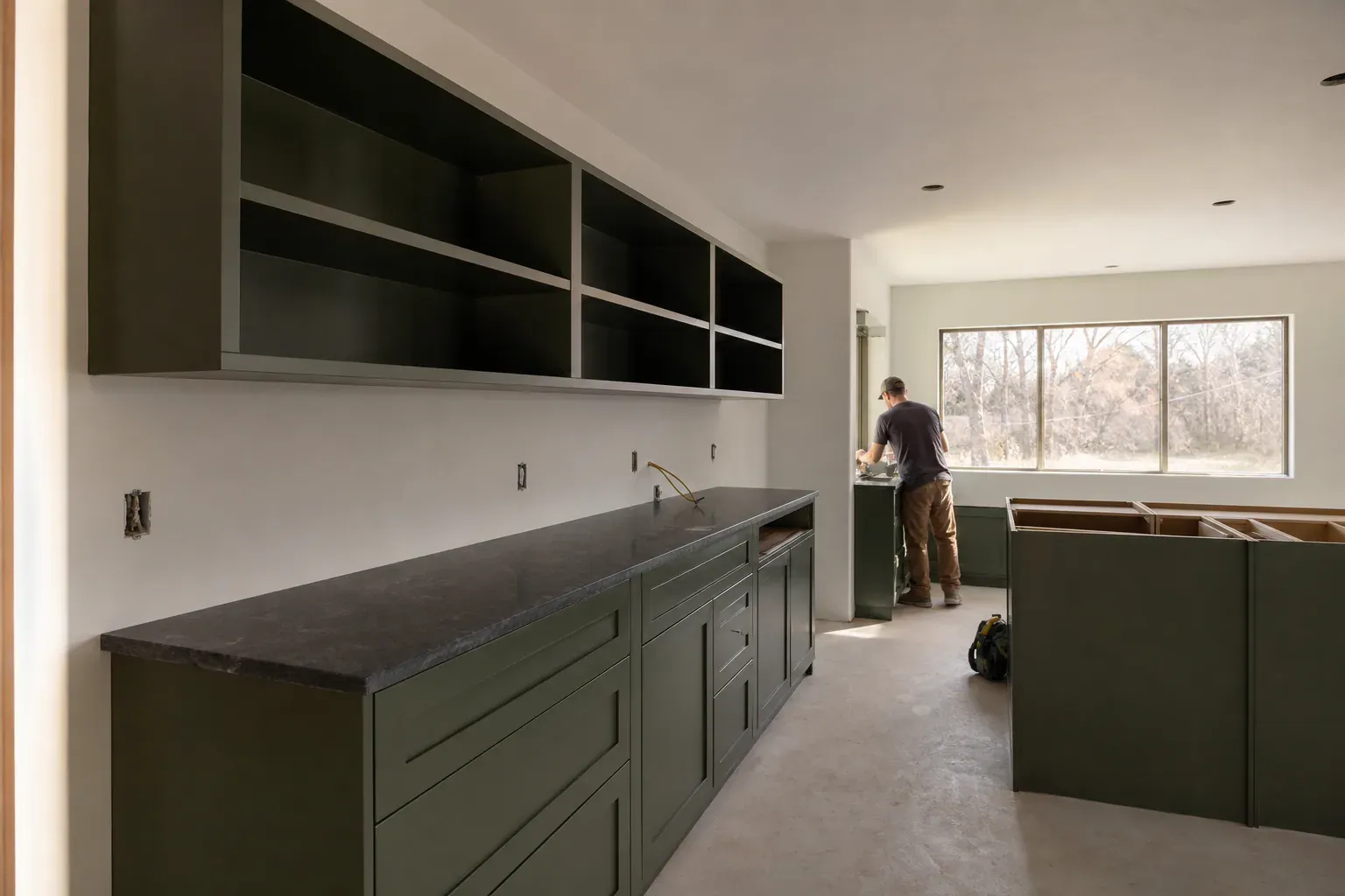 Custom cabinets in Garden City Id — clean lines of finished wall running toward the window of a small commercial suite